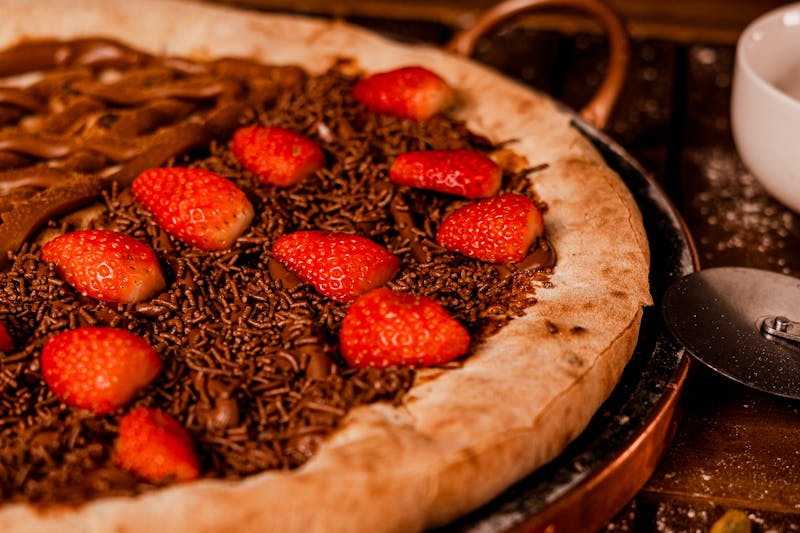 Nutella pizza dessert with strawberries